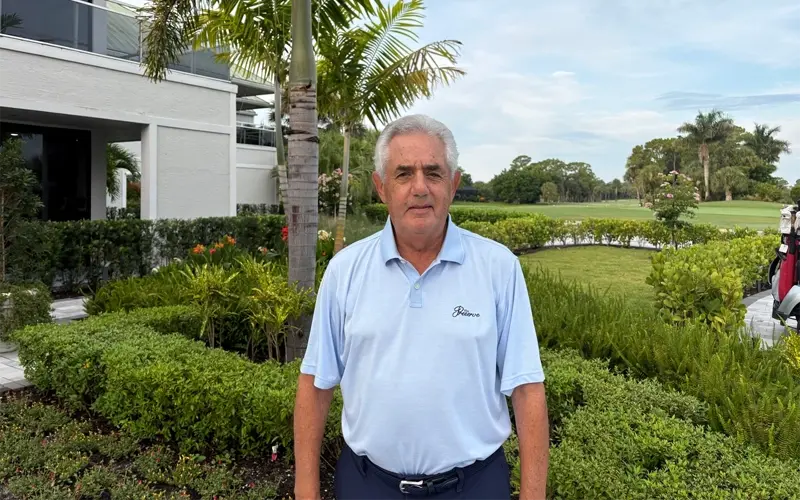 Joe Nardo posing outside by the golf course
